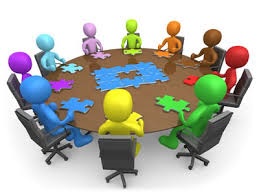 colorful stick figures around table 